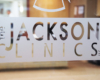 The Jackson Clinics logo etched on a window