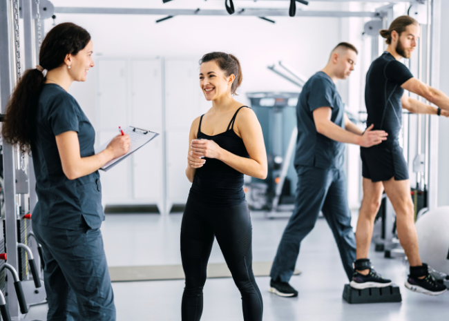 Orthopedic physical therapy, patients with physical therapist in clinic working on pain conditions