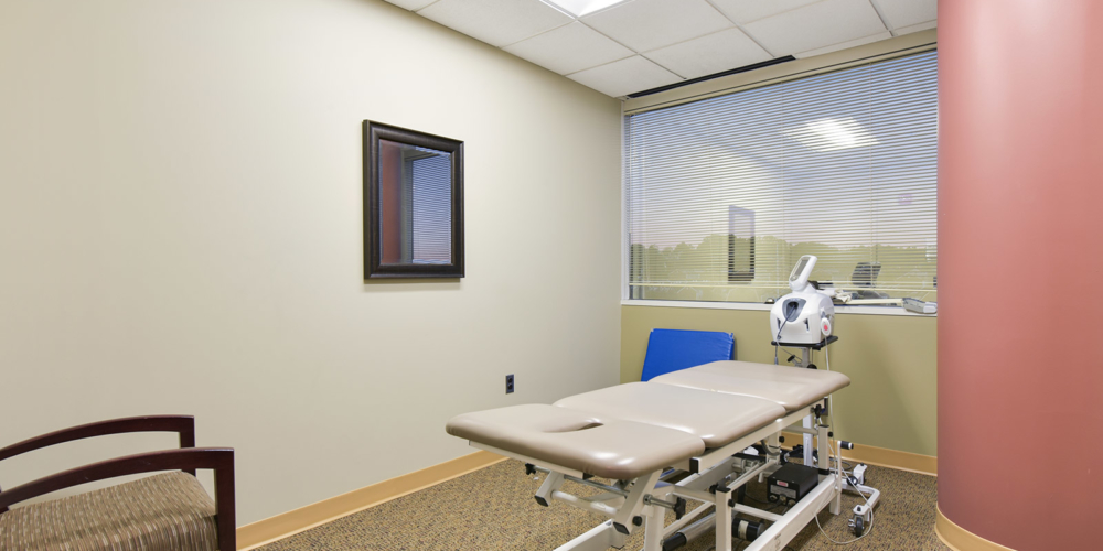 private room with physical therapy table