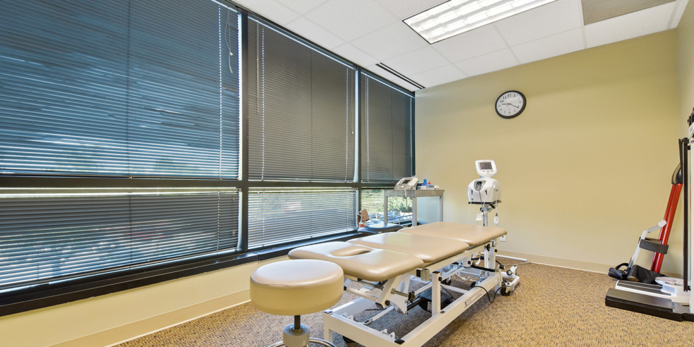 private room with physical therapy table