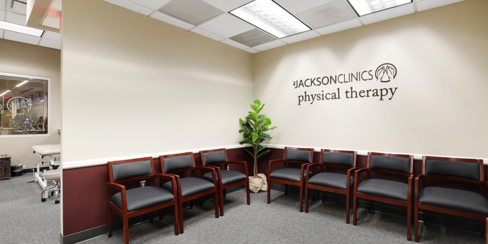 clinic waiting area with The Jackson Clinics Physical Therapy on the back wall