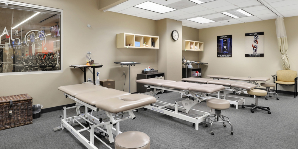 physical therapy tables in the open area