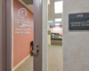 front door to clinic suite with logo that reads The Jackson Clinics Physical Therapy and looks into the waiting area