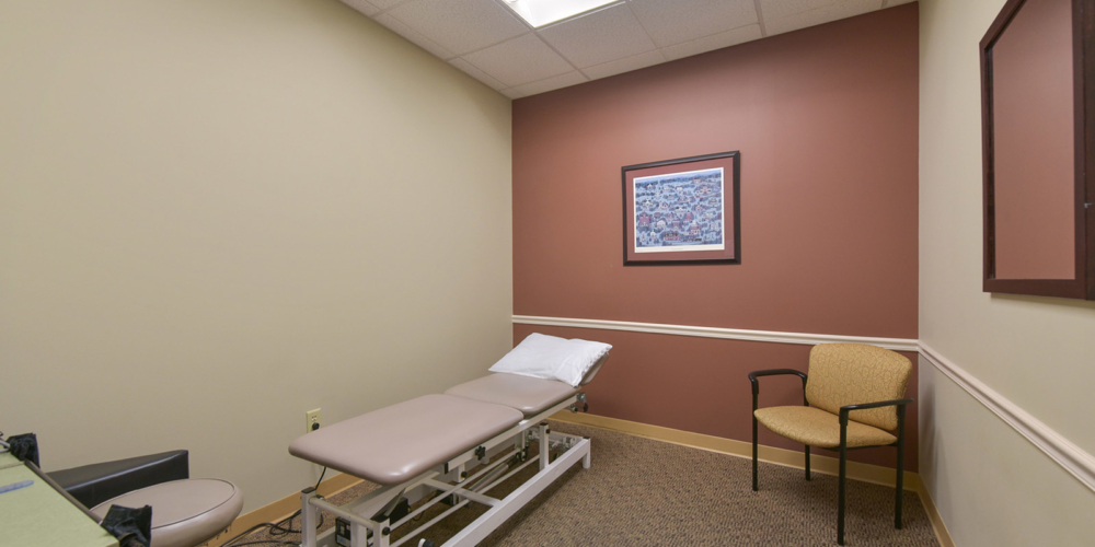 private room with physical therapy table