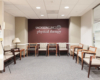 Waiting area with an accent wall that reads The Jackson Clinics Physical Therapy