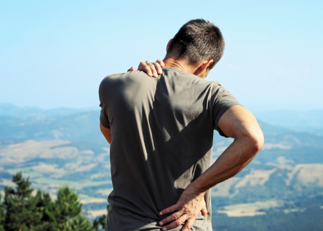 physical therapy for back pain causes and symptoms man dealing with back pain needs physical therapy treatment